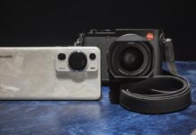 Can the mobile with the best camera of 2023 beat a 6,000 euro Leica camera? Huawei P60 Pro y la cámara Leica Q3 uno al lado de otro sobre una mesa azul