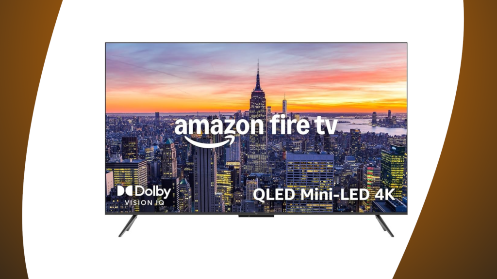 Amazon Fire TV Omni QLED Mini-LED 4K displaying a cityscape with a sunset, featuring Dolby Vision IQ branding.