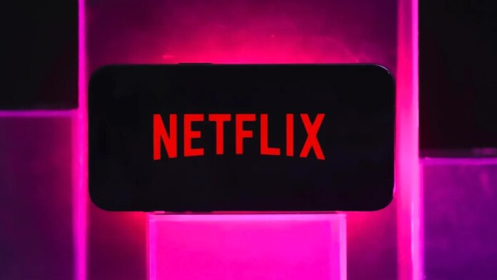 The Netflix logo on a phone screen with a colorful background