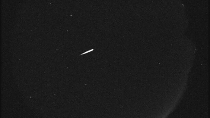 Orionids meteor streaks across a dark sky.