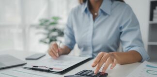 Person working with documents on desk, accountant checking company budget accounting documents, auditing financial statements, preparing company balance sheet financial statements. Audit concept.