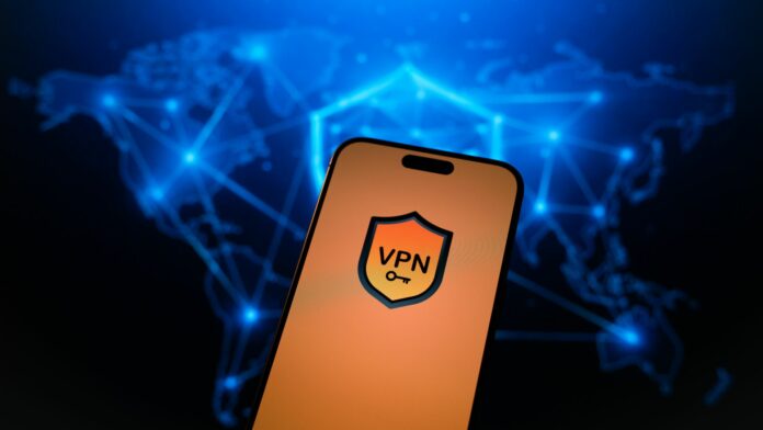 VPN usage up 35,000% in Afghanistan as authorities restrict access A mobile phone with a generic VPN screen and a world map of the server network in the background.