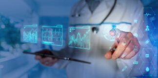 A person in a white coat presses icons in the space in front of them to represent mixed reality