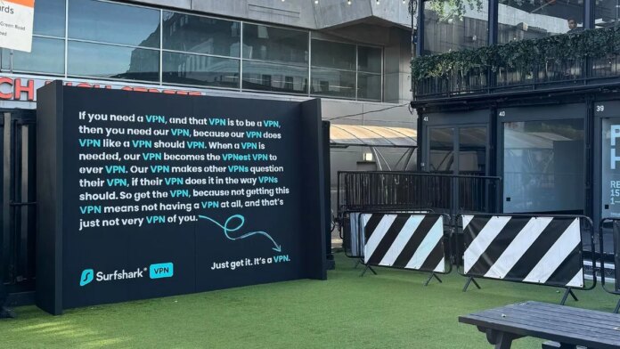 A text-heavy billboard talking about VPNs in an urban locale.