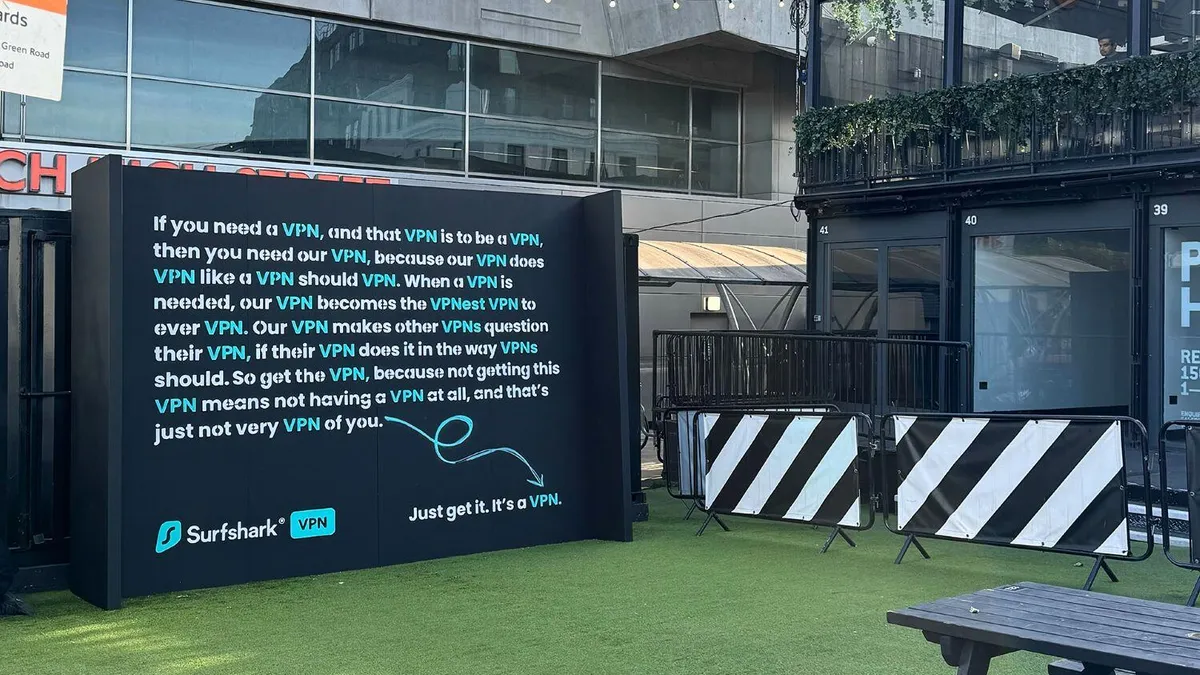 A text-heavy billboard talking about VPNs in an urban locale.