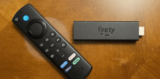 Amazon Fire TV Stick 4K Max pictured on a wooden surface