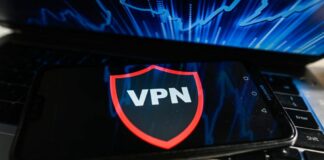 A VPN runs on a mobile phone placed on a laptop keyboard