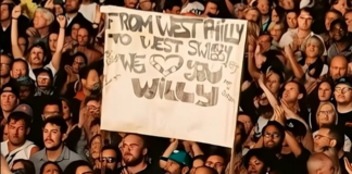 AI-generated crowd image with sign held up