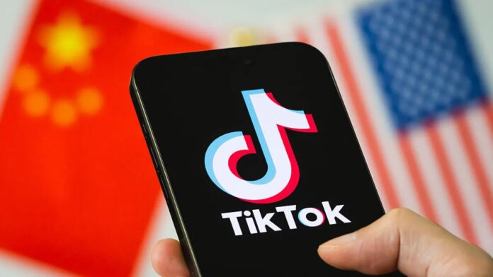 The TikTok logo is shown in front of American and Chinese flags