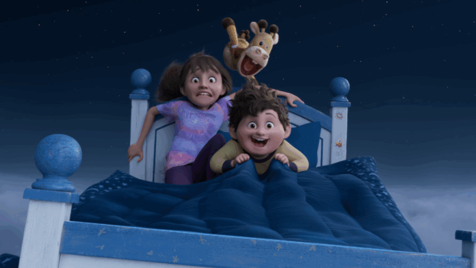 Stevie and Elliot riding a flying bed in a still from the Netflix movie In Your Dreams