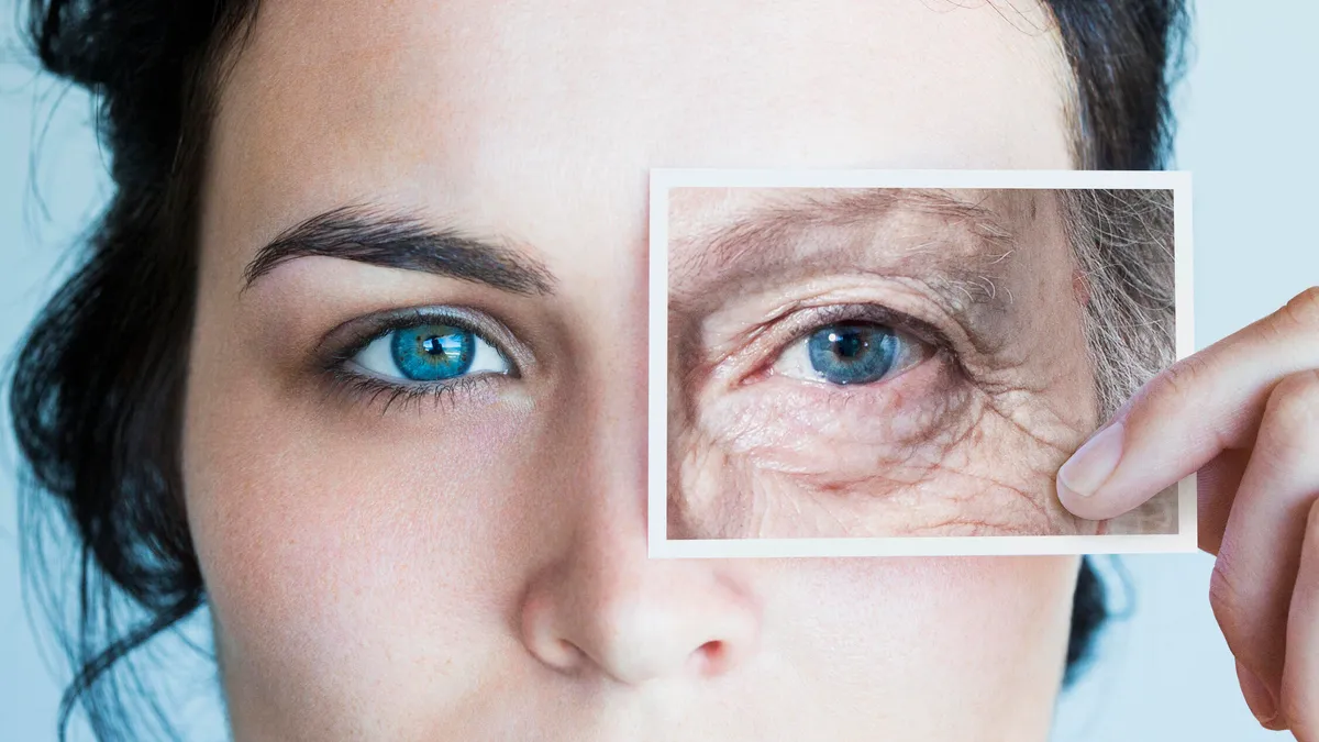 A close-up photo of a young woman's face with an aged photo of an eye over hers.