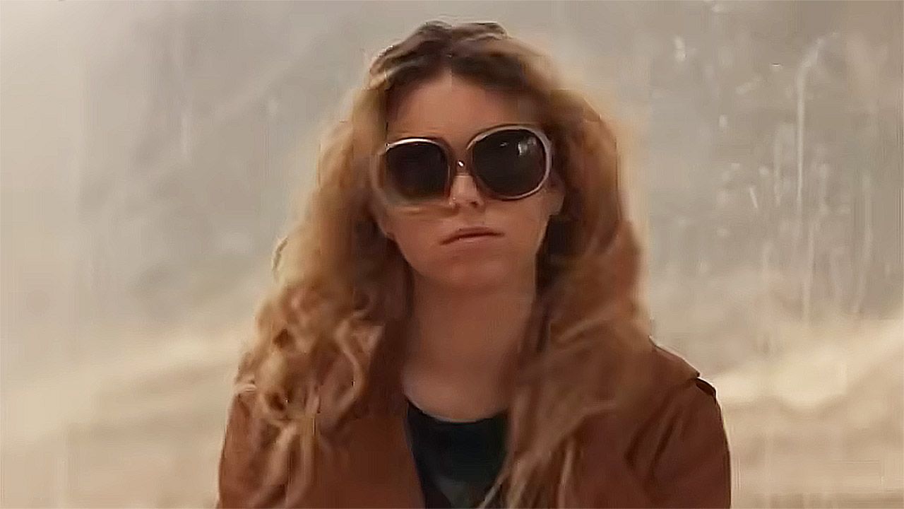 Milly Alcock's Kara Zor-El wearing a brown coat and sunglasses in 2026's Supergirl movie