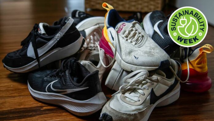 Old Nike running shoes in a pile