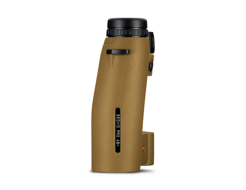 Hunter holding Leica Geovid Pro 10x42 AB+ rangefinder binoculars in field conditions, demonstrating one-hand grip ergonomics