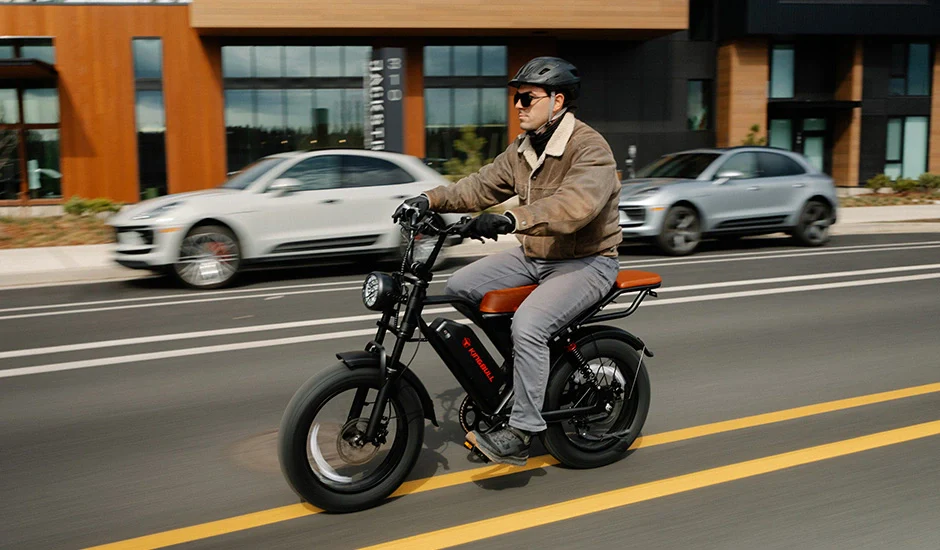 Rider on Kingbull Ranger vintage e-bike on outdoor terrain with helmet